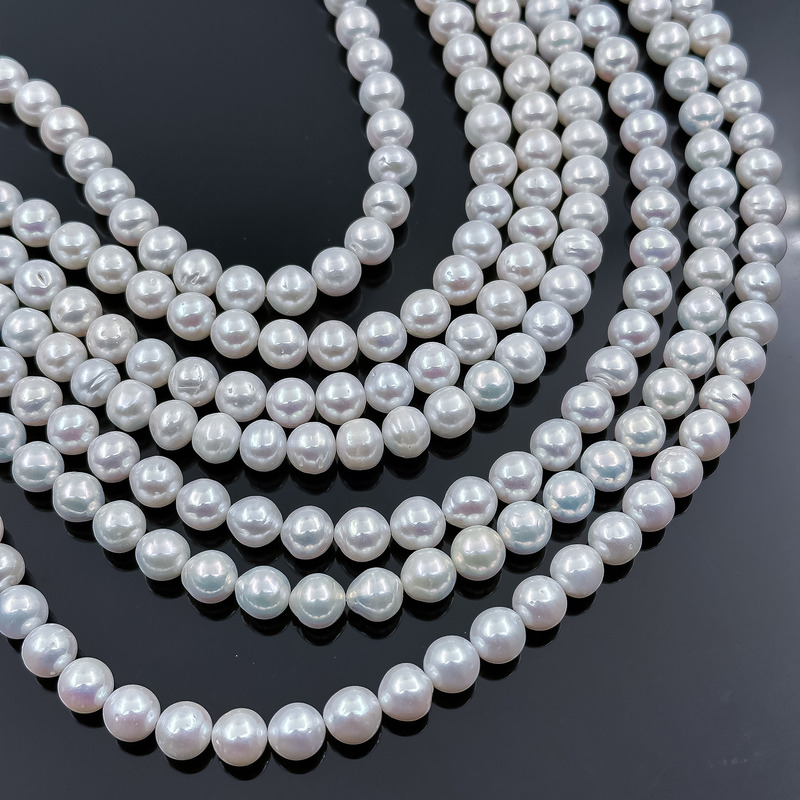 Жемчуг белый. Бусины 8.5-9 мм. Нить 40 см.